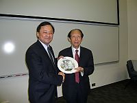 Prof. Chen Guoliang (right), Academician of College of Software in Shenzhen University receives a souvenir from Prof. Benjamin Wah (left), Provost of CUHK
